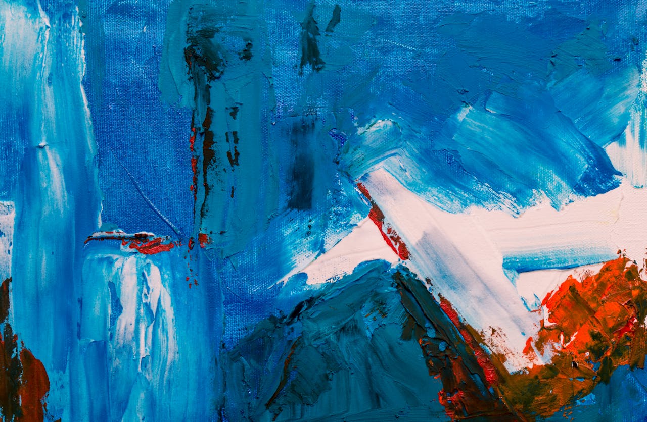 A vibrant abstract painting with dynamic blue and red color palette highlighting brush strokes and textures.